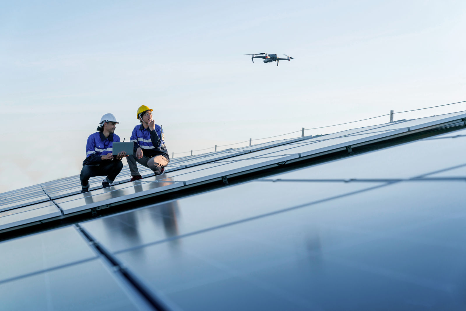 Engineers on a solar roof