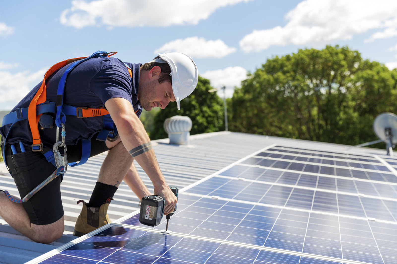 Engineers installing a solar panel