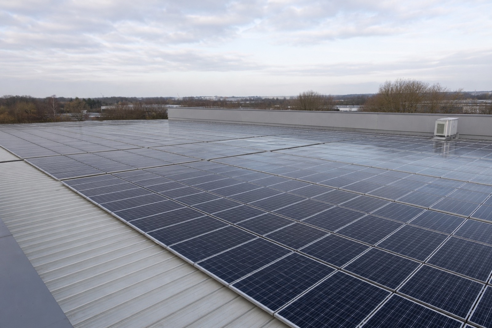 Solar panels covering a commercial warehouse roof
